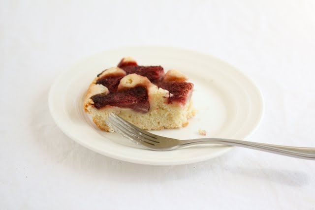 photo of a piece of cake on a plate with a fork