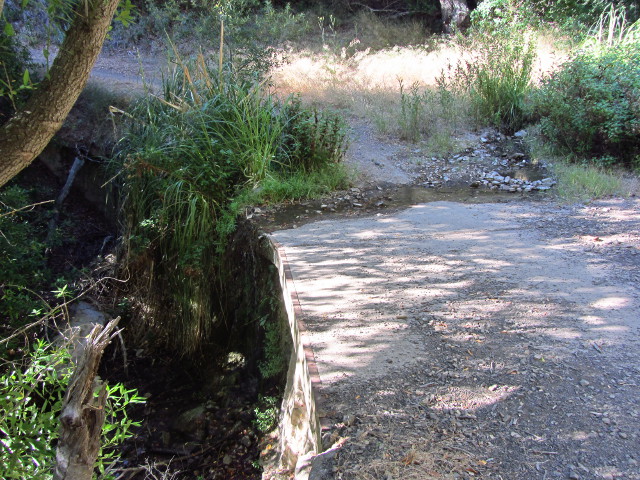 water flowing over a concrete ford