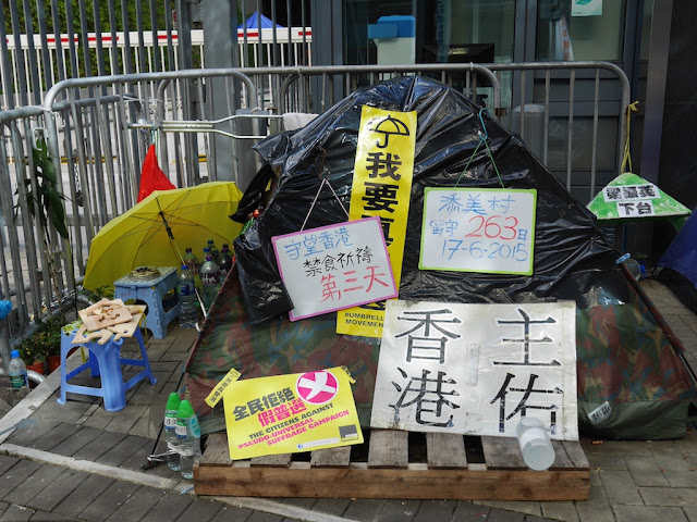 a tent with Umbrella Movement signs