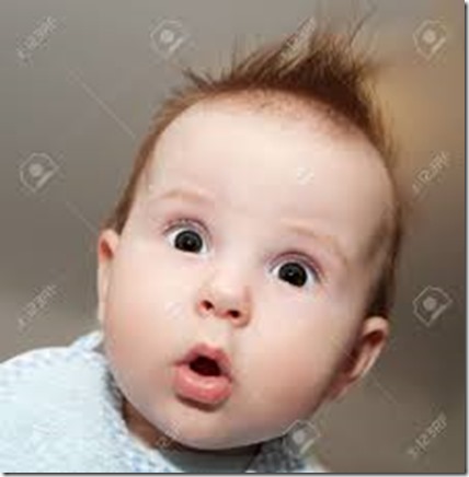 22123012-Cute-4-months-old-baby-making-a-funny-surprised-face-Stock-Photo