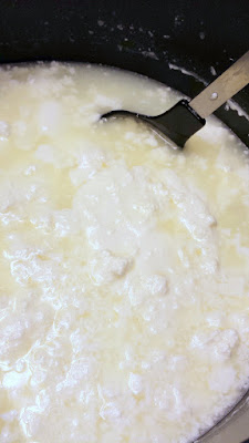 Making homemade ricotta- so easy, just whole milk, heavy cream, and a little acid via lemon juice or vinegar combined with heat. Here you can see the curds have separated, so now strain the cheese from the whey with cheesecloth over a mesh strainer