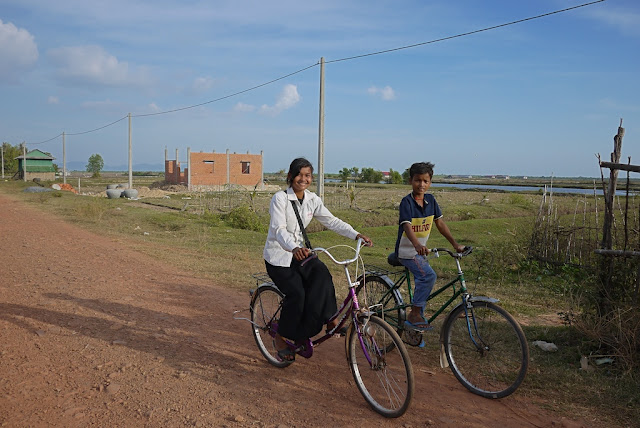 girl and boy riding bikes