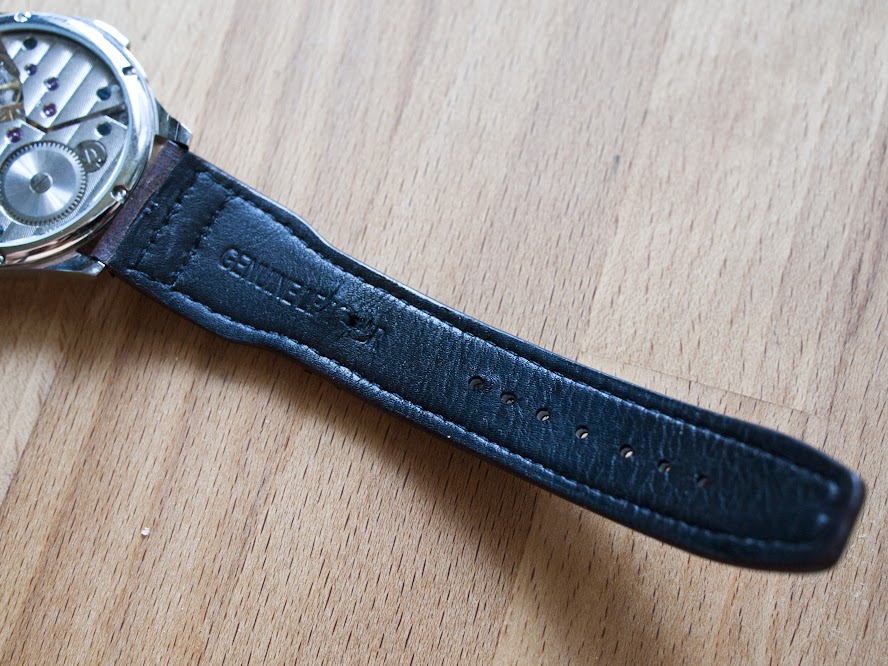 The exceedingly cheap-feeling “genuine leather” strap.
        I felt okay about grinding a hole through it with a razor for my short
        wrist.