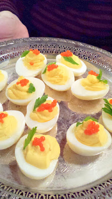 Deviled eggs with bread & butter pickled green garlic & hot sauce caviar