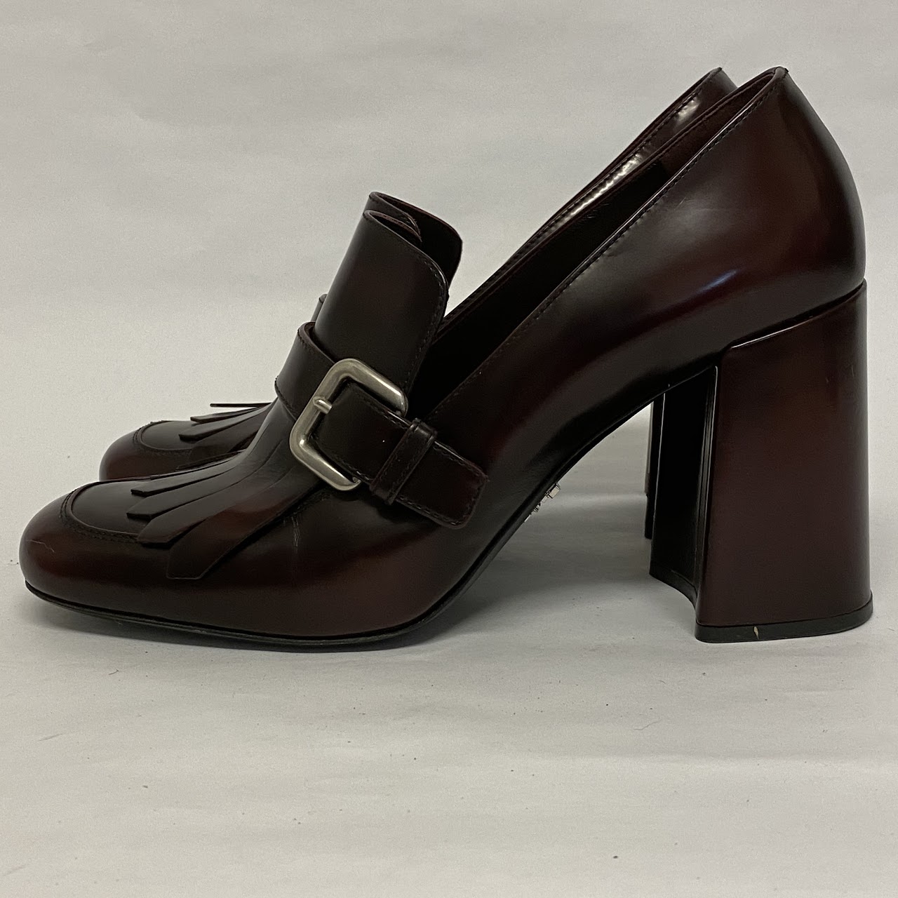 Prada Burgundy Kiltie Pumps