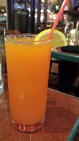 Cocktail with housemade mango juice and rose water