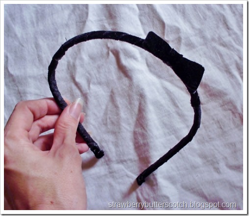 A black velvet headband made with fabric scraps.