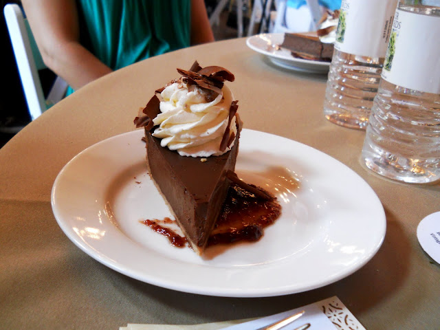 Spiced Chocolate Silk Pie Cocoa Crust with Dried Chilies Whipped Cream atop Cherry Chili Coulis