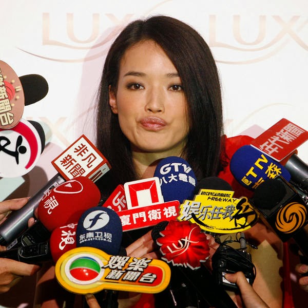 Hong Kong-based and Taiwan-born actress Shu Qi reacts to a question during a news conference in Taipei.