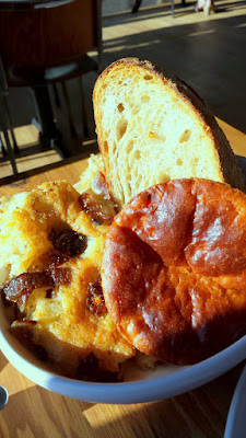 From the Tavola section at Renata, Pane basket that includes foccacia, pugliese, and tomato panettone with 3 accompaniments that included porcini whipped butter, honey, and an olive compote