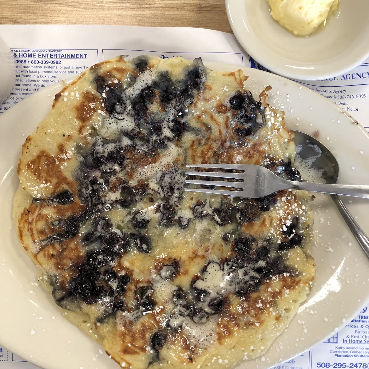 HUGE pancake served with a large mound of butter (which I moved off to a separate dish). Though the sheer size was a bit off-putting the cake was light and fluffy. I ate less than half.