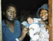 EARLY BLOOMER: Inspector Patricia Malindi, Sophie Mgcina and newborn Palesa at the Evaton police station. Pic. Len Kumalo. © Sowetan.