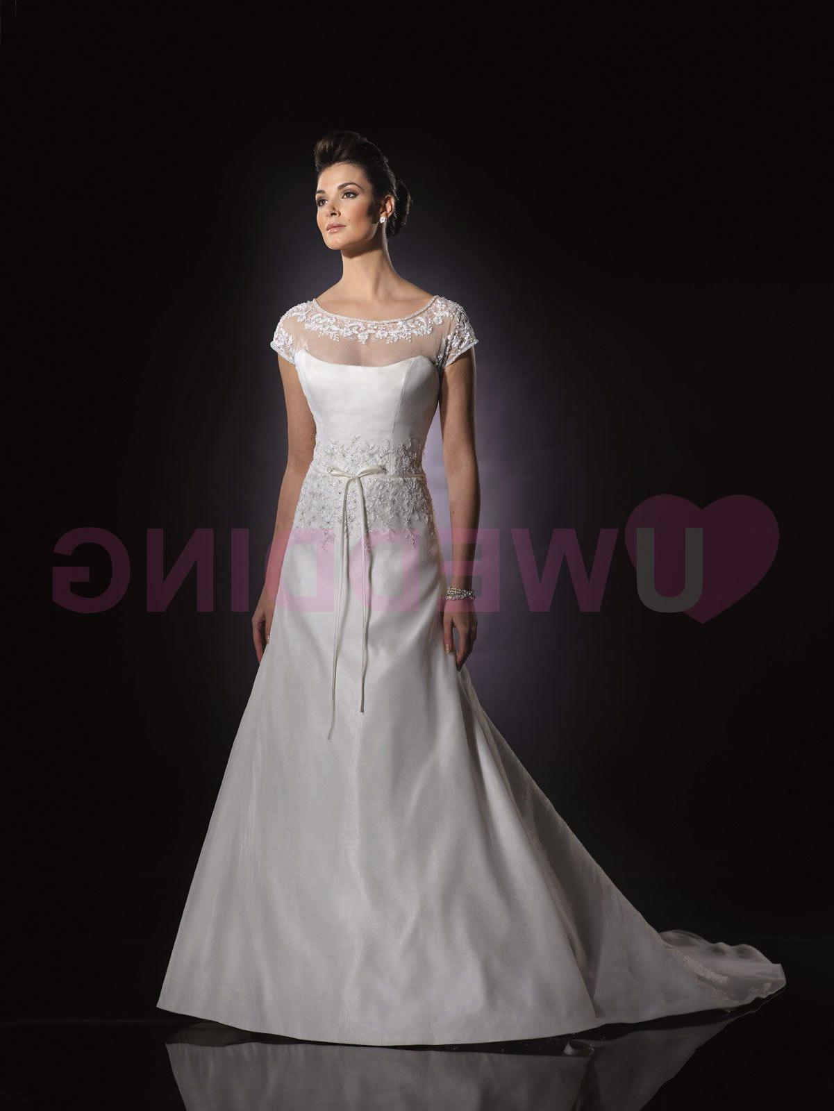 with cap sleeves, illusion back bodice with covered button closures,