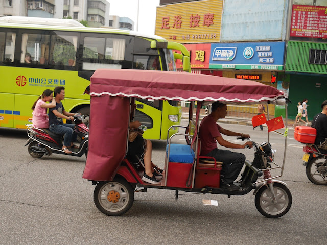 Motor-rickshaw with a PRC flag in Zhongshan, China