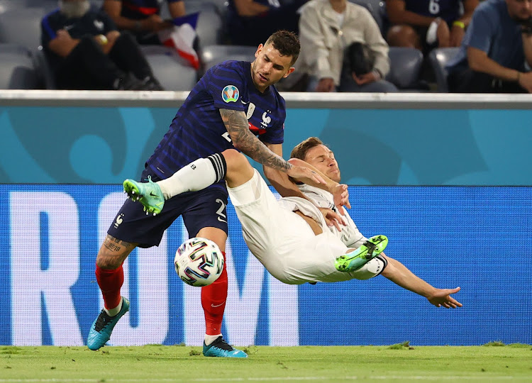 France's Lucas Hernandez in action with Germany's Joshua Kimmich