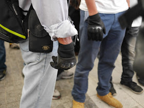 people wearing hard-knuckle gloves