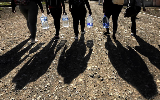 Residents of Serala View and Flora Park in Polokwane have had to rely on municipal water tanks after low pressure from a nearby reservoir resulted in taps running dry. They've blocked a contractor from working and are demanding subcontracts. / ESA ALEXANDER