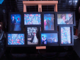 Photo frame filled with our wedding photos and blue floral print 