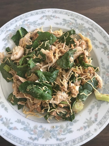 Plate of Thai Turkey Salad on bed of Spinach