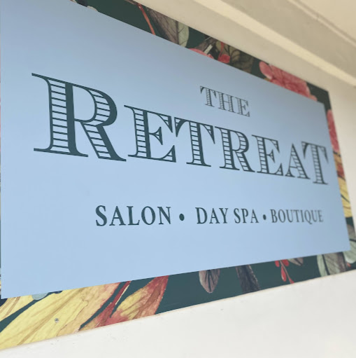 The Retreat Salon & Day Spa logo