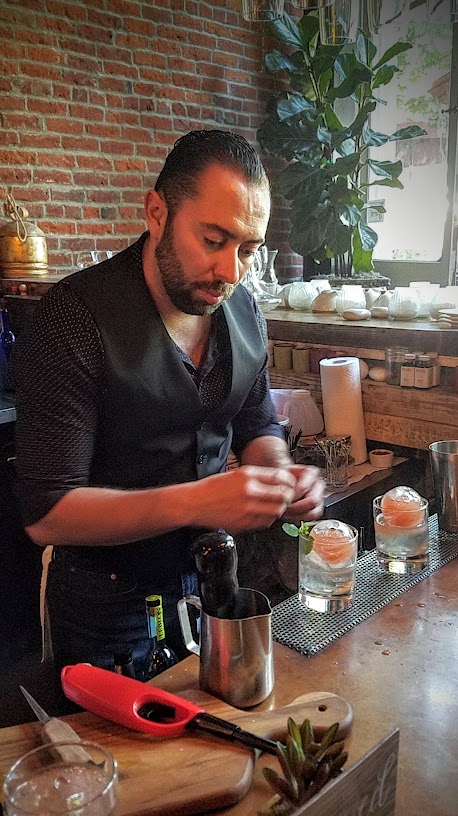 This Rompe-hielo (Icebreaker) with Aguadiente, watermelon juice, mint syrup, lime, and ginger beer comes in a ice sphere that is then broken from LeChon