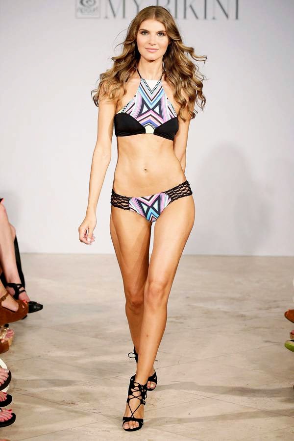 A model walks the runway at the Rip Curl presentation during Mercedes-Benz Fashion Week Swim 2015 at The Raleigh on July 19, 2014 in Miami Beach, Florida.