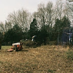 Click to Expand Owen standing on top of the brush pile to pack it down before moving it.