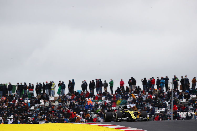 Daniel Ricciardo of Australia driving the (3) Renault Sport Formula One Team RS20 as spectators look on during the F1 Grand Prix of Portugal at Autodromo Internacional do Algarve on October 25 2020 in Portimao, Portugal.