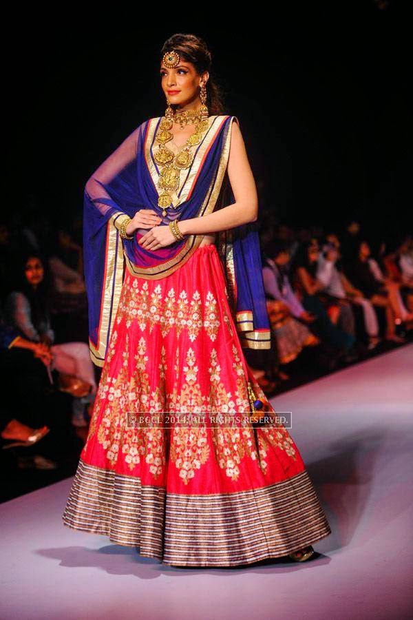 A model showcases a creation by Mahabir & KIK Jewells on Day 3 of India International Jewellery Week (IIJW), 2014, held at Grand Hyatt, in Mumbai.    