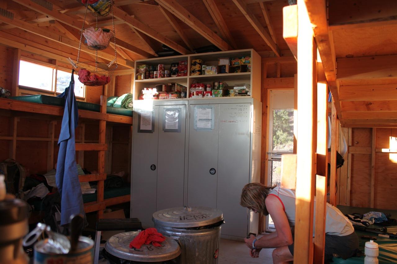 Interior of Wedding Bell hut. The bunks, pantry, and living area of Wedding