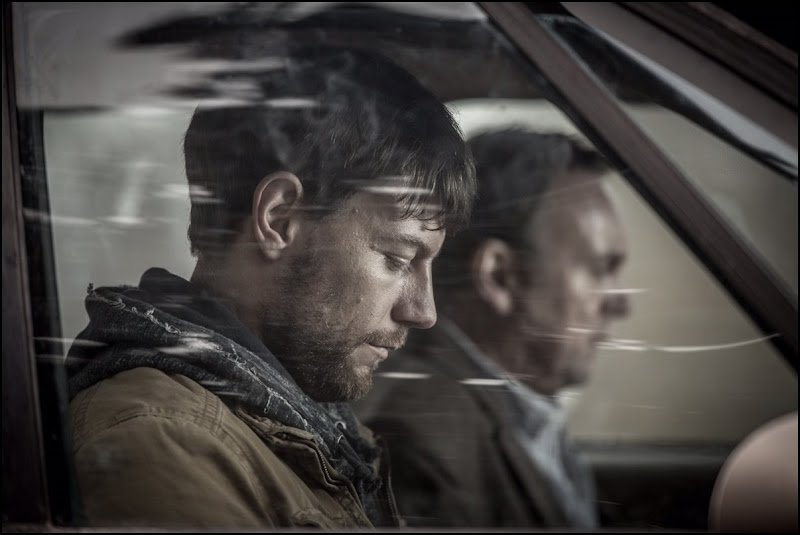 Patrick Fugit and Philip Glenister in Outcast