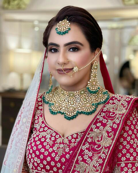 Punjabi girl's traditional wedding reception make-up - Village Barber ...