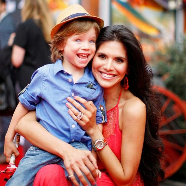 Actress Joyce Giraud arrives to the premiere of 'Planes: Fire & Rescue' with her son Leonardo Ohoven at the El Capitan Theater in the Hollywood section of Los Angeles, California, July 15, 2014. 