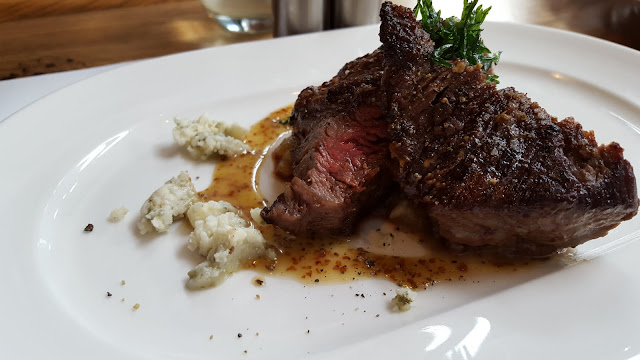 Prime rib cap, sweet onion relish, Pointe Reyes blue cheese, mustard vinaigrette. The Guild House, Columbus, Ohio 