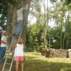 Click to Expand Owen and Betty hold ladder as George mounts the sign.