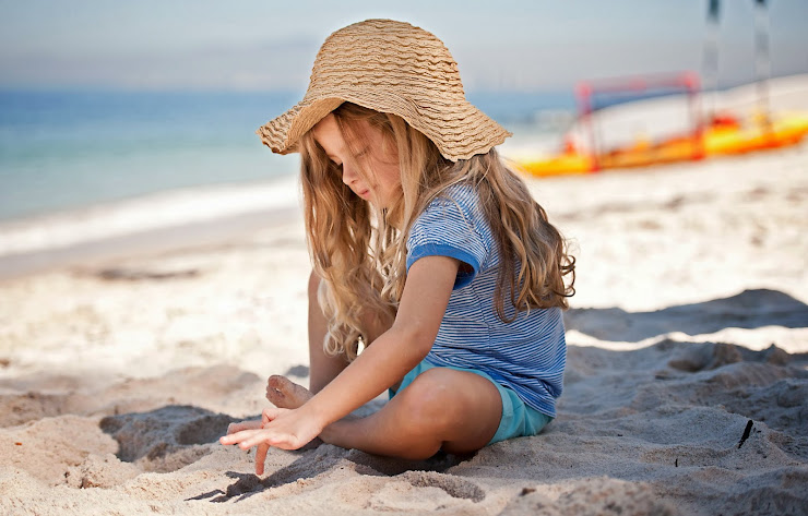 Girl playing with sand from Puerto Vallarta