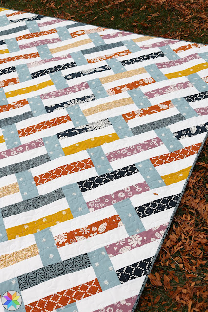 Fast Track quilt pattern by Andy Knowlton of A Bright Corner - a precut friendly quilt pattern in four sizes. A great modern jelly roll quilt pattern or fat quarter quilt pattern