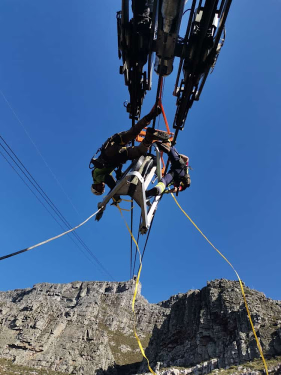 A view of the maintenance team at work near the lower cableway station.