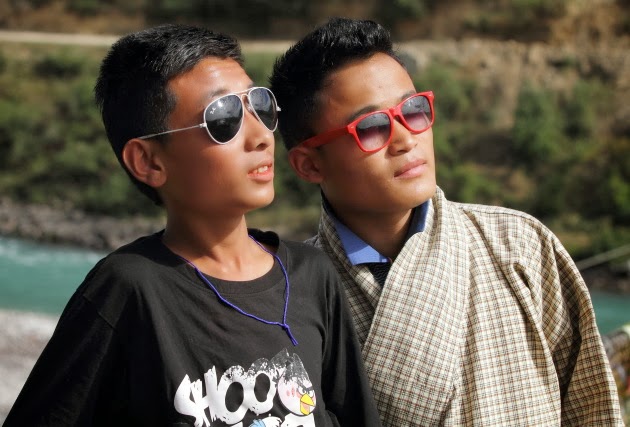 2 Bhutanese boys and their colourful sunglasses