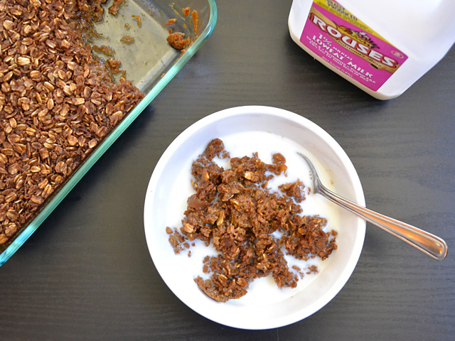 bowl of gingerbread oatmeal with milk (jug of milk and tray of oatmeal in the background) 