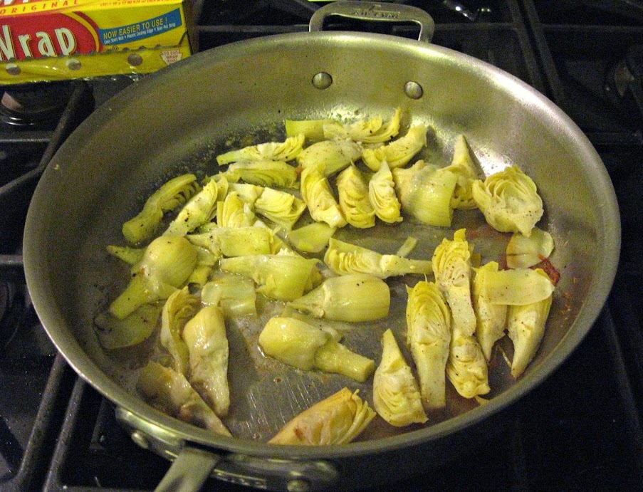 Artichoke Hearts cooking in the pan