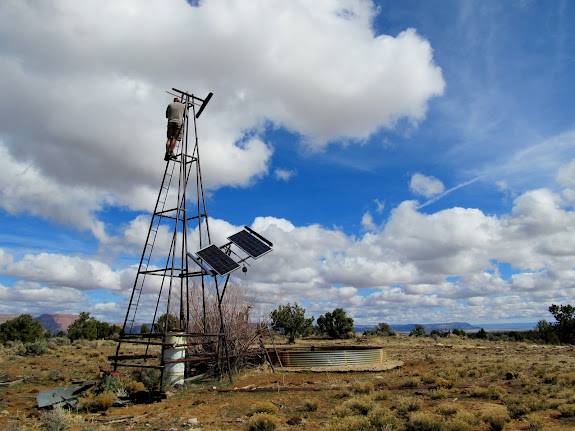 An old windmill and livestock watering trough