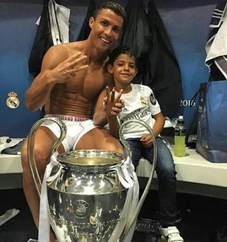 Cristiano Ronaldo and his son pictured with the Champions League Trophy