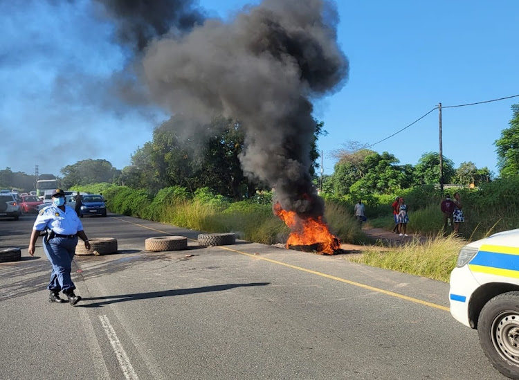 The Hans Dettman highway, south of Durban, was barricaded by protesters on Friday.