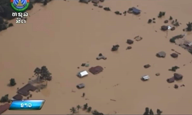 In the image made from aerial video taken Tuesday, 24 July 2018, villages are inundated with floodwaters from a collapsed dam in Attapeu province, southeastern Laos. The KPL news agency said Wednesday on its website that officials in Attapeu province also reported more than 1,300 houses damaged by flooding after an auxiliary dam at the Xepian-Xe Nam Noy hydropower project partially collapsed on Monday night. Photo: LNT / Associated Press