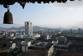 view from Yingtian Pagoda of an urban area with mountains in the background 