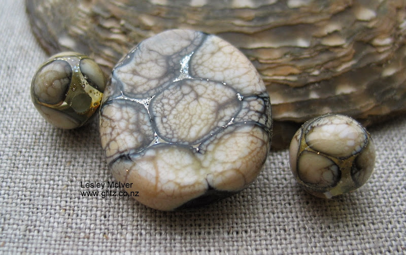 Fossils – use of pure silver foil, silvered ivory glass to give a reptilian effect. Artist Lesley McIver 