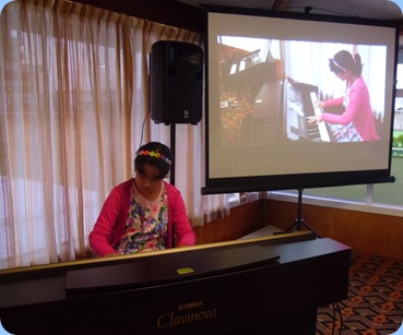 Hana Tani playing the Clavinova CVP-509. What a wonderful budding pianist! Photo courtesy of Laurie Conder.