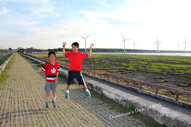 The boys doing a jump shot for the camera