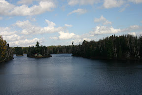 A cottage in the middle of a lake